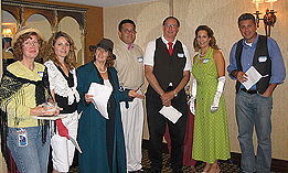 7 people dressed up for murder mystery