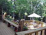 Deck with bench outside of beautiful retreat house for sale by owner